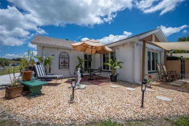 Tucked away on a quaint cul-de-sac, this WATERFRONT POOL HOME in on Duffys Golf Center in Florida - for sale on GolfHomes.com, golf home, golf lot