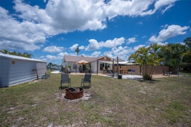 Tucked away on a quaint cul-de-sac, this WATERFRONT POOL HOME in on Duffys Golf Center in Florida - for sale on GolfHomes.com, golf home, golf lot