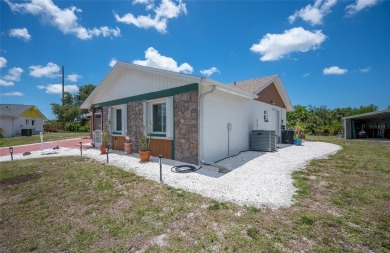 Tucked away on a quaint cul-de-sac, this WATERFRONT POOL HOME in on Duffys Golf Center in Florida - for sale on GolfHomes.com, golf home, golf lot