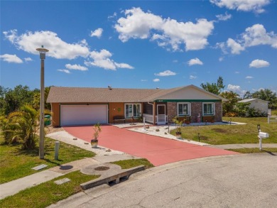 Tucked away on a quaint cul-de-sac, this WATERFRONT POOL HOME in on Duffys Golf Center in Florida - for sale on GolfHomes.com, golf home, golf lot