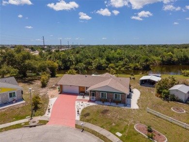 Tucked away on a quaint cul-de-sac, this WATERFRONT POOL HOME in on Duffys Golf Center in Florida - for sale on GolfHomes.com, golf home, golf lot