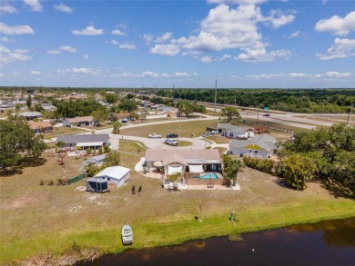 Tucked away on a quaint cul-de-sac, this WATERFRONT POOL HOME in on Duffys Golf Center in Florida - for sale on GolfHomes.com, golf home, golf lot