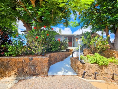 Hidden from the road by mature landscaping (terraced lava rock on Waikoloa Village Golf Club in Hawaii - for sale on GolfHomes.com, golf home, golf lot