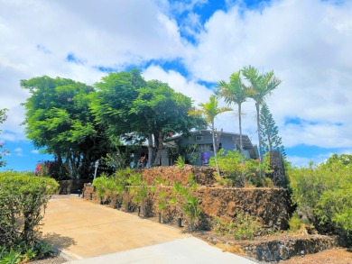 Hidden from the road by mature landscaping (terraced lava rock on Waikoloa Village Golf Club in Hawaii - for sale on GolfHomes.com, golf home, golf lot