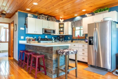 Wake up to the sounds of nature, unwind by the fire, and take in on The Hideout Golf in Pennsylvania - for sale on GolfHomes.com, golf home, golf lot