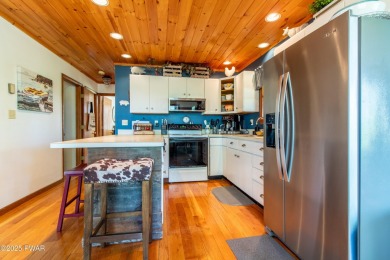 Wake up to the sounds of nature, unwind by the fire, and take in on The Hideout Golf in Pennsylvania - for sale on GolfHomes.com, golf home, golf lot