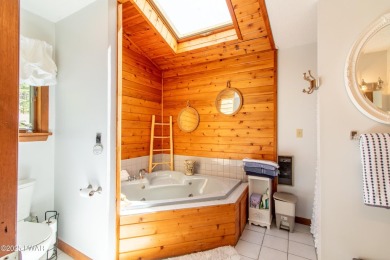 Wake up to the sounds of nature, unwind by the fire, and take in on The Hideout Golf in Pennsylvania - for sale on GolfHomes.com, golf home, golf lot