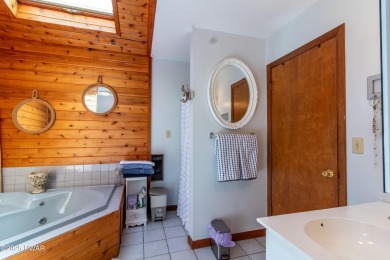 Wake up to the sounds of nature, unwind by the fire, and take in on The Hideout Golf in Pennsylvania - for sale on GolfHomes.com, golf home, golf lot