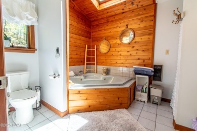 Wake up to the sounds of nature, unwind by the fire, and take in on The Hideout Golf in Pennsylvania - for sale on GolfHomes.com, golf home, golf lot