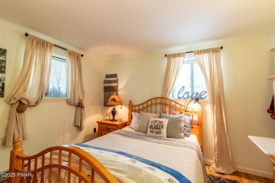 Wake up to the sounds of nature, unwind by the fire, and take in on The Hideout Golf in Pennsylvania - for sale on GolfHomes.com, golf home, golf lot