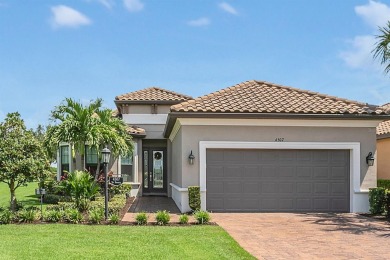 Discover luxurious comfort in this stunning on Esplanade Golf and Country at Lakewood Ranch in Florida - for sale on GolfHomes.com, golf home, golf lot