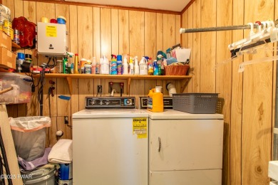 Wake up to the sounds of nature, unwind by the fire, and take in on The Hideout Golf in Pennsylvania - for sale on GolfHomes.com, golf home, golf lot