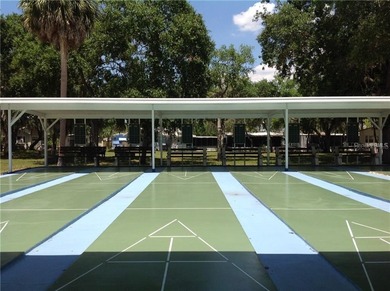 HUGE PRICE IMPROVEMENT ON THIS WELL-KEPT MOBILE HOME IN AN on River Run Golf Links in Florida - for sale on GolfHomes.com, golf home, golf lot