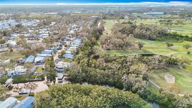 HUGE PRICE IMPROVEMENT ON THIS WELL-KEPT MOBILE HOME IN AN on River Run Golf Links in Florida - for sale on GolfHomes.com, golf home, golf lot