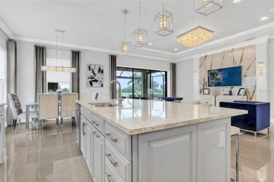 Discover luxurious comfort in this stunning on Esplanade Golf and Country at Lakewood Ranch in Florida - for sale on GolfHomes.com, golf home, golf lot