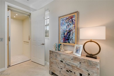 Arrive by PRIVATE ELEVATOR and step into a home that immediately on Pelican Preserve Golf Club in Florida - for sale on GolfHomes.com, golf home, golf lot