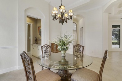 CUSTOM BUILT POOL HOME WITH GOLF & WATER VIEWS in the on The Legacy Golf and Tennis Club in Florida - for sale on GolfHomes.com, golf home, golf lot