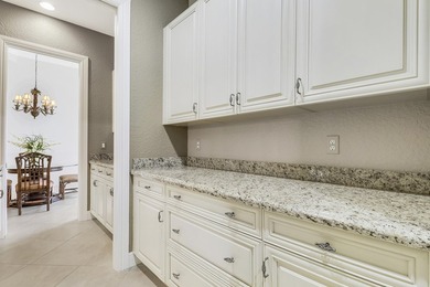 CUSTOM BUILT POOL HOME WITH GOLF & WATER VIEWS in the on The Legacy Golf and Tennis Club in Florida - for sale on GolfHomes.com, golf home, golf lot