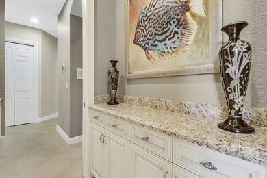 CUSTOM BUILT POOL HOME WITH GOLF & WATER VIEWS in the on The Legacy Golf and Tennis Club in Florida - for sale on GolfHomes.com, golf home, golf lot