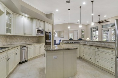 CUSTOM BUILT POOL HOME WITH GOLF & WATER VIEWS in the on The Legacy Golf and Tennis Club in Florida - for sale on GolfHomes.com, golf home, golf lot