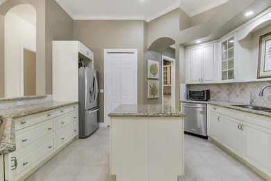 CUSTOM BUILT POOL HOME WITH GOLF & WATER VIEWS in the on The Legacy Golf and Tennis Club in Florida - for sale on GolfHomes.com, golf home, golf lot