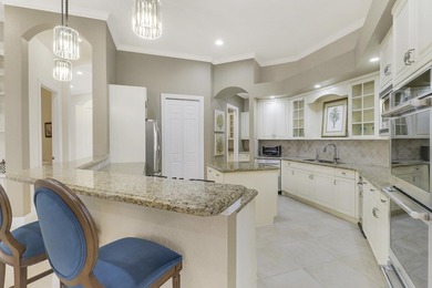 CUSTOM BUILT POOL HOME WITH GOLF & WATER VIEWS in the on The Legacy Golf and Tennis Club in Florida - for sale on GolfHomes.com, golf home, golf lot