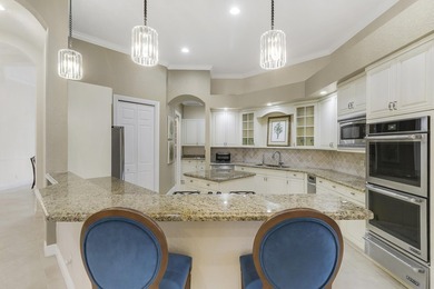 CUSTOM BUILT POOL HOME WITH GOLF & WATER VIEWS in the on The Legacy Golf and Tennis Club in Florida - for sale on GolfHomes.com, golf home, golf lot