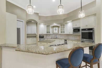 CUSTOM BUILT POOL HOME WITH GOLF & WATER VIEWS in the on The Legacy Golf and Tennis Club in Florida - for sale on GolfHomes.com, golf home, golf lot