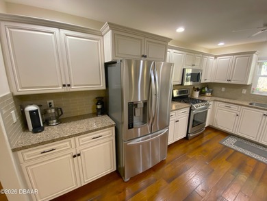 This beautiful home boasts a newer December 2024 roof and is in on Tomoka Oaks Golf and Country Club in Florida - for sale on GolfHomes.com, golf home, golf lot