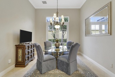 CUSTOM BUILT POOL HOME WITH GOLF & WATER VIEWS in the on The Legacy Golf and Tennis Club in Florida - for sale on GolfHomes.com, golf home, golf lot