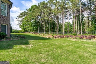 Welcome to this exceptional 3-sided brick and stone executive on Hamilton Mill Golf Club in Georgia - for sale on GolfHomes.com, golf home, golf lot