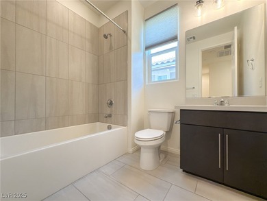 Discover elevated living in this stunning townhome nestled in on Reflection Bay Golf Club in Nevada - for sale on GolfHomes.com, golf home, golf lot