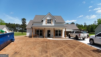 This modern farmhouse ranch-style home is situated right on the on Cabin Creek Golf Club in Georgia - for sale on GolfHomes.com, golf home, golf lot