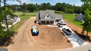 This modern farmhouse ranch-style home is situated right on the on Cabin Creek Golf Club in Georgia - for sale on GolfHomes.com, golf home, golf lot