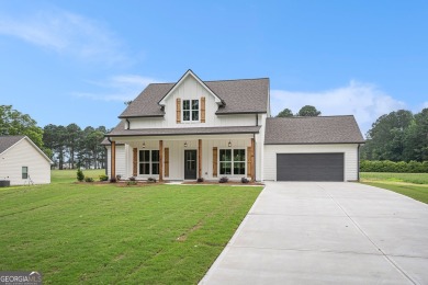 This modern farmhouse ranch-style home is situated right on the on Cabin Creek Golf Club in Georgia - for sale on GolfHomes.com, golf home, golf lot