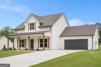 This modern farmhouse ranch-style home is situated right on the on Cabin Creek Golf Club in Georgia - for sale on GolfHomes.com, golf home, golf lot