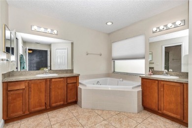 Nestled in an active 55+ community, this 3-bedroom, 2-bath home on Summerglen Country Club in Florida - for sale on GolfHomes.com, golf home, golf lot