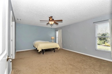 Nestled in an active 55+ community, this 3-bedroom, 2-bath home on Summerglen Country Club in Florida - for sale on GolfHomes.com, golf home, golf lot