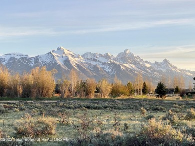 Enjoy big views of the entire Teton Range from this premium on Jackson Hole Golf and Tennis Club in Wyoming - for sale on GolfHomes.com, golf home, golf lot