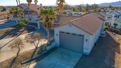 This stunning 1.5-story home offers 4 bedrooms and 2.5 bathrooms on Chaparral Golf and Country Club in Arizona - for sale on GolfHomes.com, golf home, golf lot