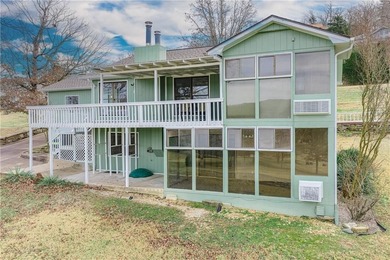 This beautifully updated home offers a prime golf course setting on Holiday Island Executive Golf Course in Arkansas - for sale on GolfHomes.com, golf home, golf lot