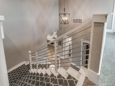 Nestled within the prestigious Oak Tree Golf and Country Club on Oak Tree National Golf and Country Club in Oklahoma - for sale on GolfHomes.com, golf home, golf lot