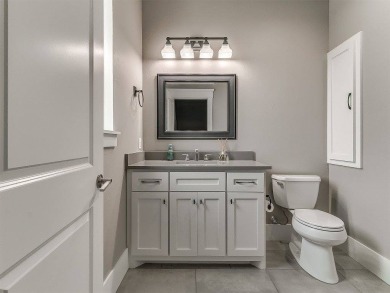 Nestled within the prestigious Oak Tree Golf and Country Club on Oak Tree National Golf and Country Club in Oklahoma - for sale on GolfHomes.com, golf home, golf lot