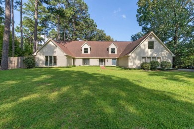 This charming Tudor style home is nestled on a large private lot on Pine Bluff Country Club in Arkansas - for sale on GolfHomes.com, golf home, golf lot