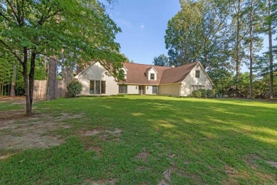 This charming Tudor style home is nestled on a large private lot on Pine Bluff Country Club in Arkansas - for sale on GolfHomes.com, golf home, golf lot