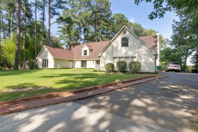 This charming Tudor style home is nestled on a large private lot on Pine Bluff Country Club in Arkansas - for sale on GolfHomes.com, golf home, golf lot