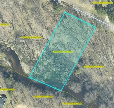 A beautiful wooded one acre lot with creek frontage located on on The Links of Bowen Lake in Michigan - for sale on GolfHomes.com, golf home, golf lot