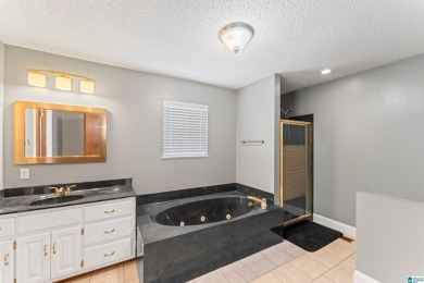 Nestled on a spacious lot alongside the golf course, this home on Cumberland Lake Country Club in Alabama - for sale on GolfHomes.com, golf home, golf lot