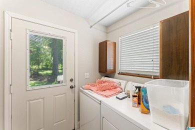 Nestled on a spacious lot alongside the golf course, this home on Cumberland Lake Country Club in Alabama - for sale on GolfHomes.com, golf home, golf lot