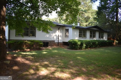 Welcome to your dream home overlooking Hole 2 of the prestigious on Honey Creek Country Club in Georgia - for sale on GolfHomes.com, golf home, golf lot